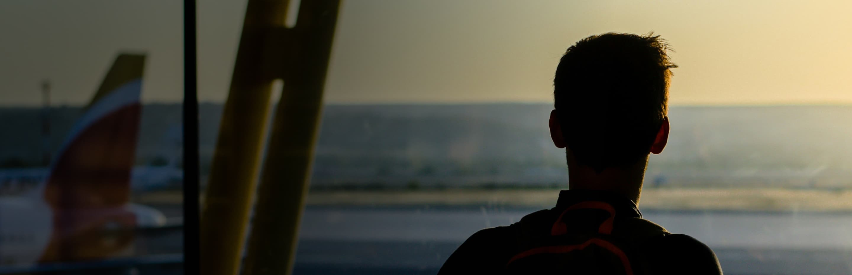 Anxious passenger looking out of the plane window